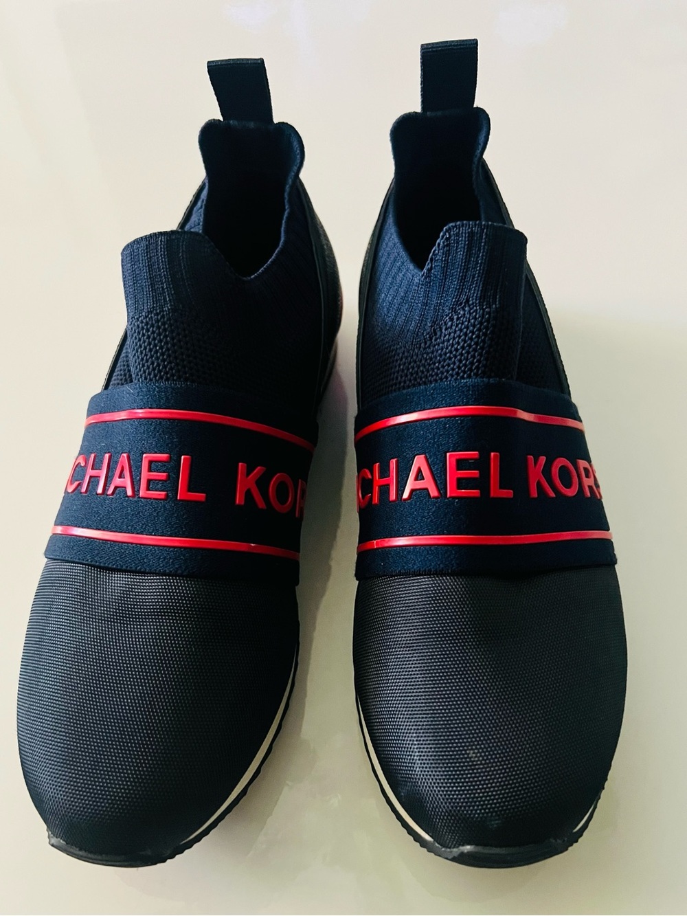 Michael Kors Women’s Blue Slip-On Sneakers with Red Logo Band